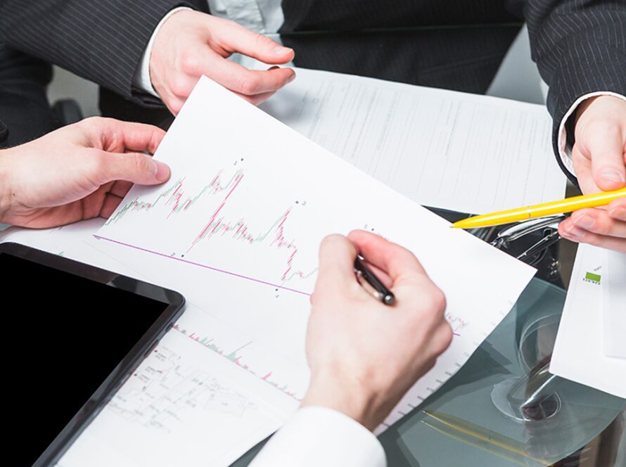 close up two businesspeople analyzing report office