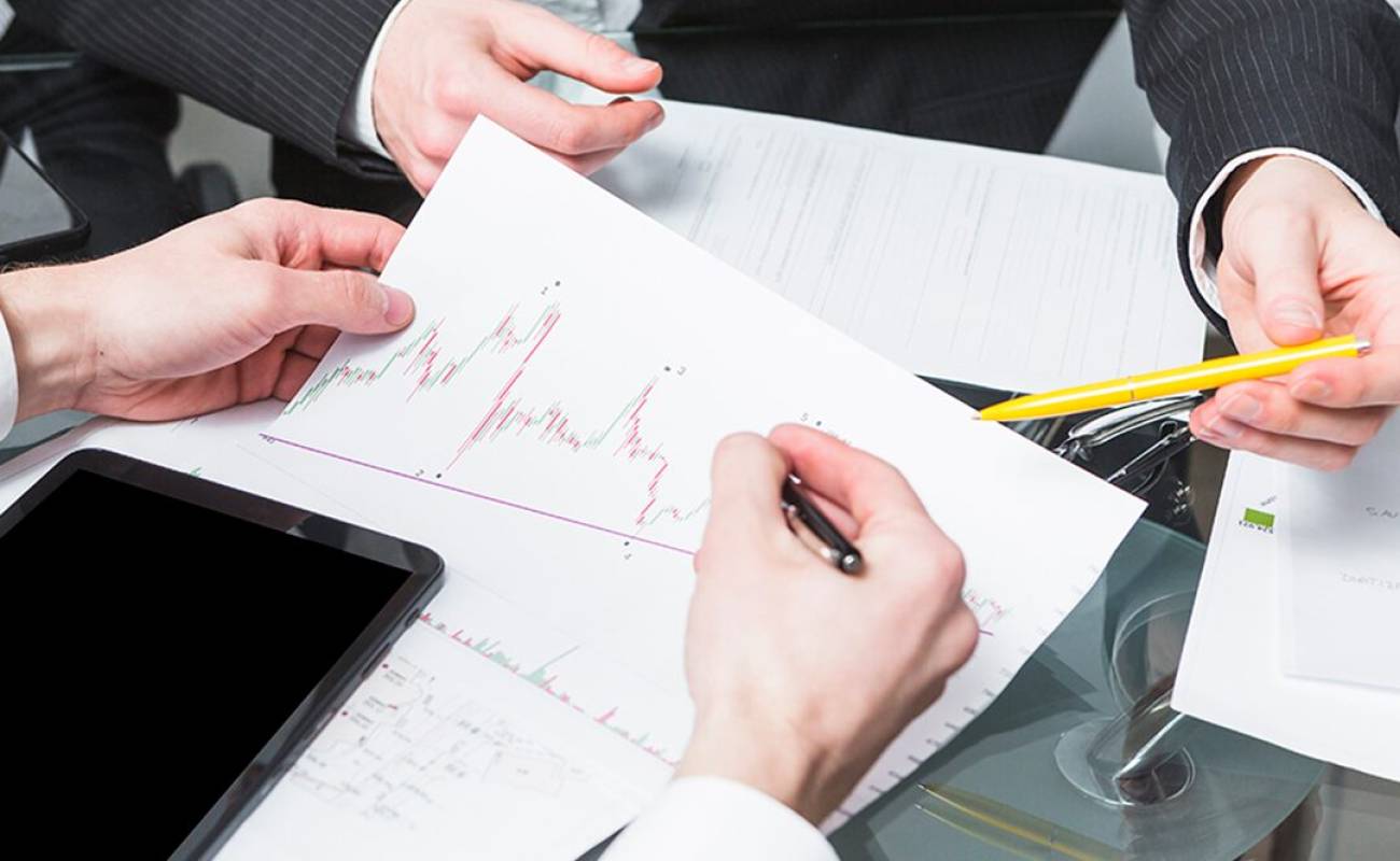 close up two businesspeople analyzing report office